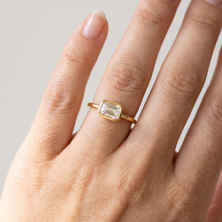 East-West Emerald Bezel Ring