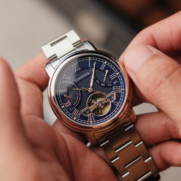 Heritage Longcase Double Retrograde Calendar Open Heart Automatic Blue / Stainle