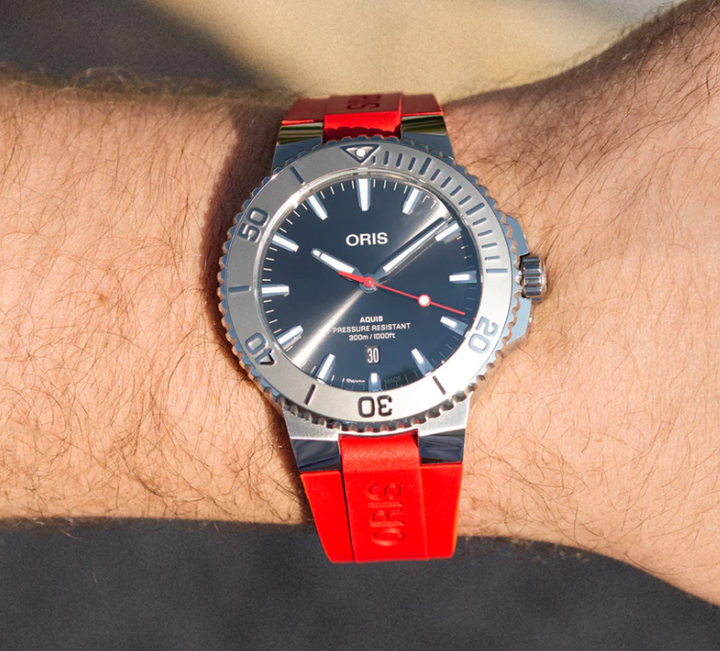 Aquis Date Relief Black/Red Rubber Black Dial
