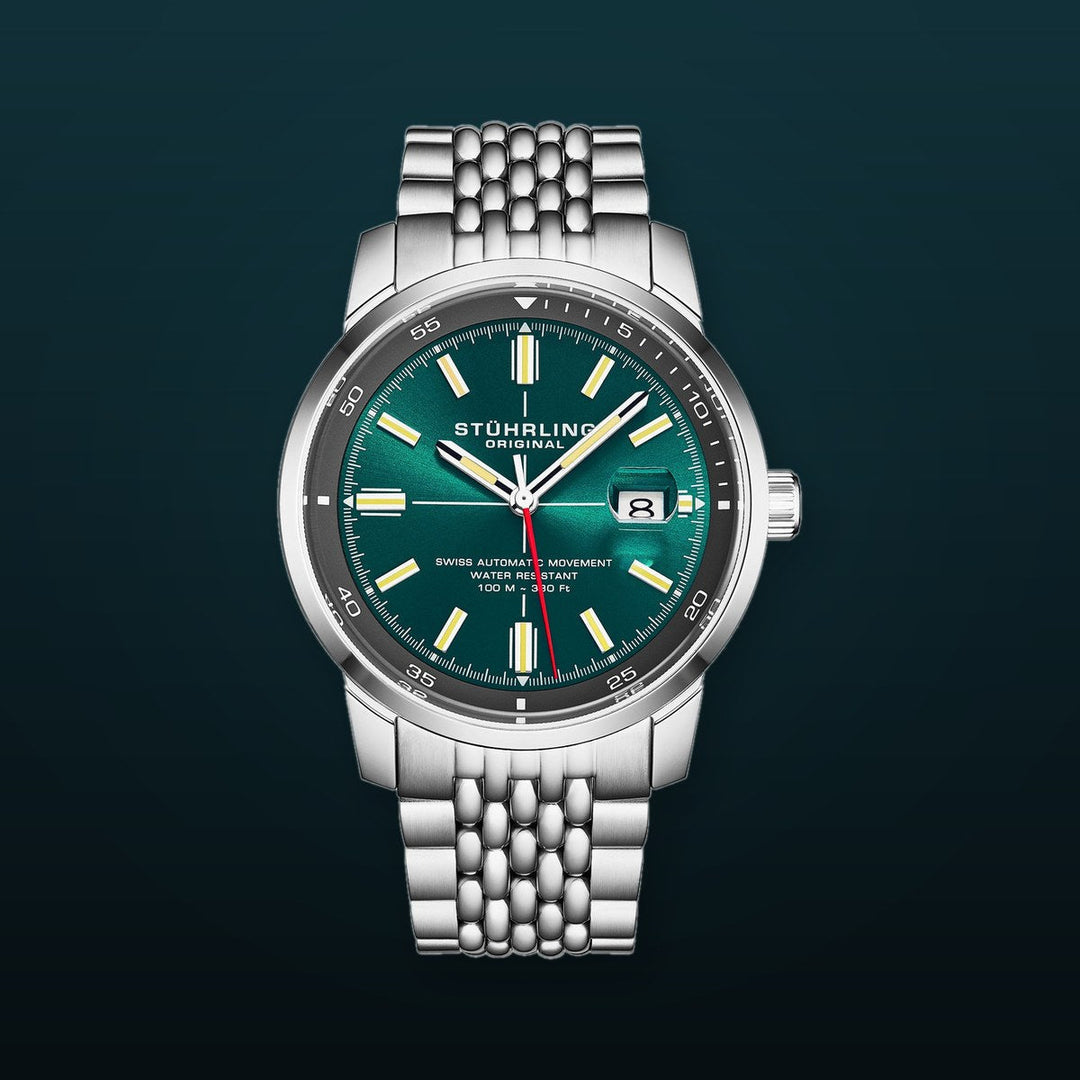 Trackmaster 1026 Automatic Men’s 42mm Sunray Teal Dial/Gray Inner Ring/Stainless Steel Bracelet