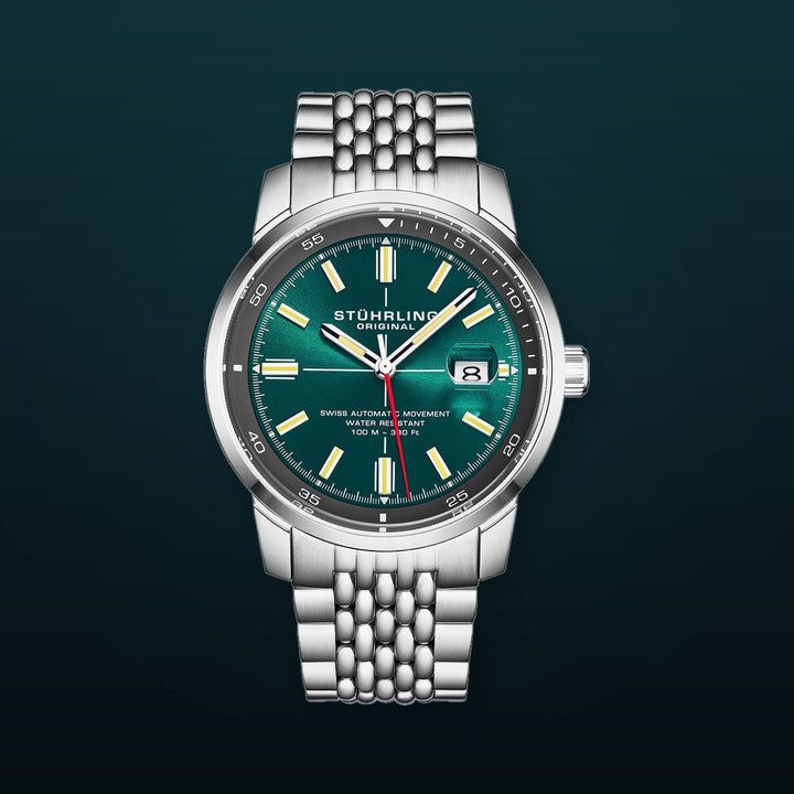 Trackmaster 1026 Automatic Men’s 42mm Sunray Teal Dial/Gray Inner Ring/Stainless Steel Bracelet